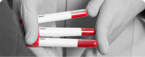 test tubes with a red tip in hands in silicon gloves